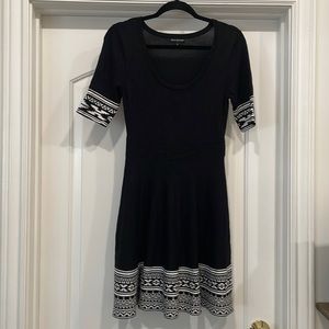 Nina Leonard Black dress, no sleeves, tulle skirt and loose neck.